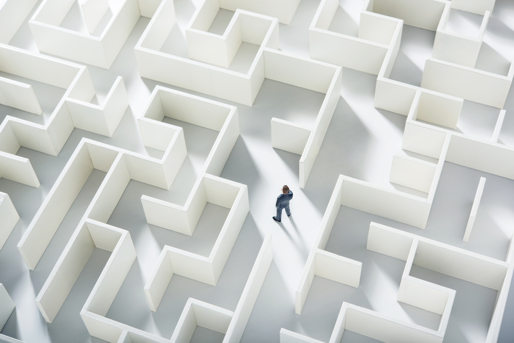 Business,Challenge.,A,Businessman,Navigating,Through,A,Maze.,Top,View